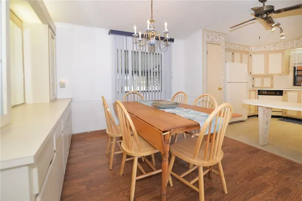 a view of a dining room with furniture and window