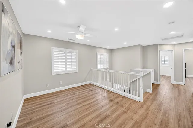 a spacious bathroom with a granite countertop sink mirror and shower