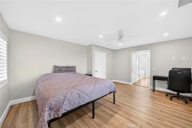 a spacious bathroom with a granite countertop sink and a mirror