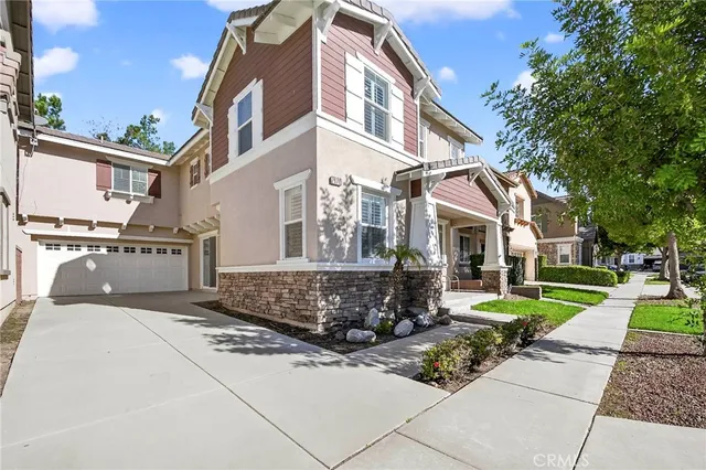 a view of a livingroom with a window and wooden floor