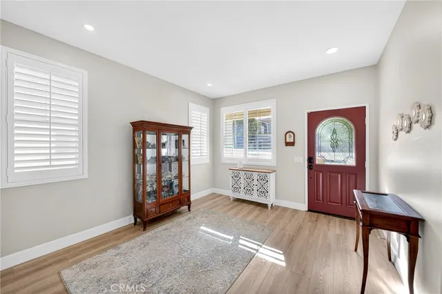 a view of an entryway with wooden floor