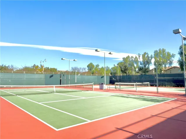 a view of an empty room with a window and fireplace