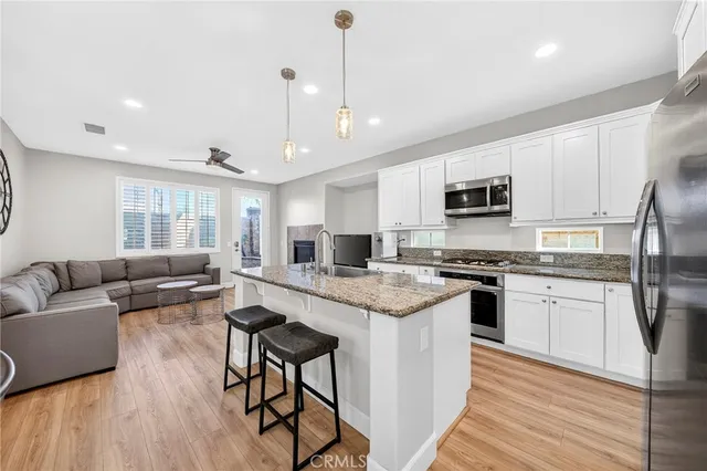 a view of a livingroom with furniture and a window