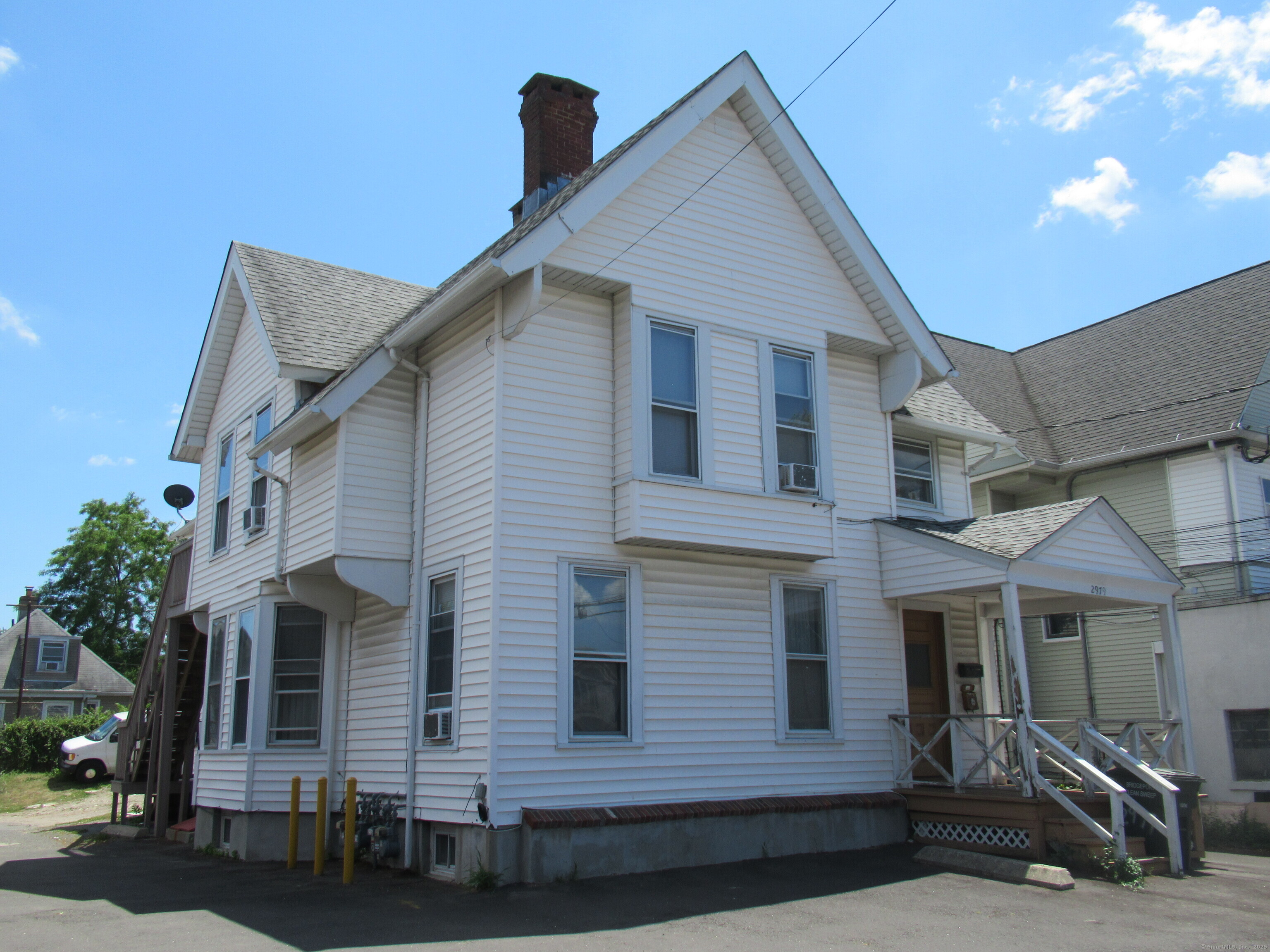 2979 Fairfield Avenue, Unit 1R Bridgeport, CT 06605 - Photo 11 of 13 a front view of a house with glass windows