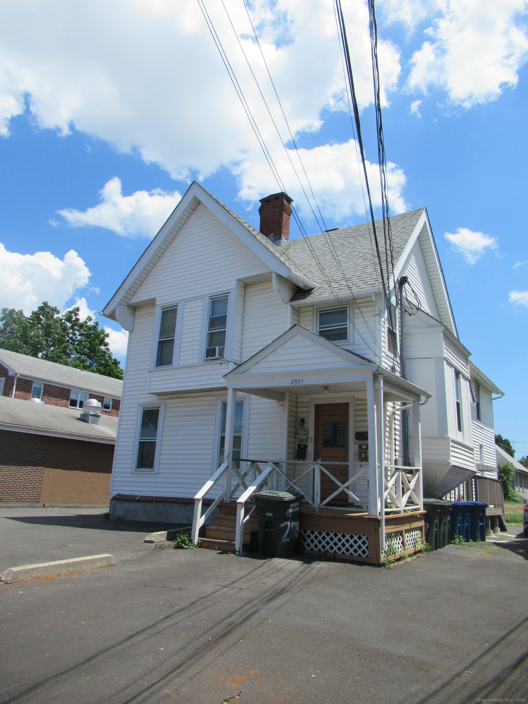 2979 Fairfield Avenue, Unit 1R Bridgeport, CT 06605 - Photo 13 of 13 a view of a white house with large windows