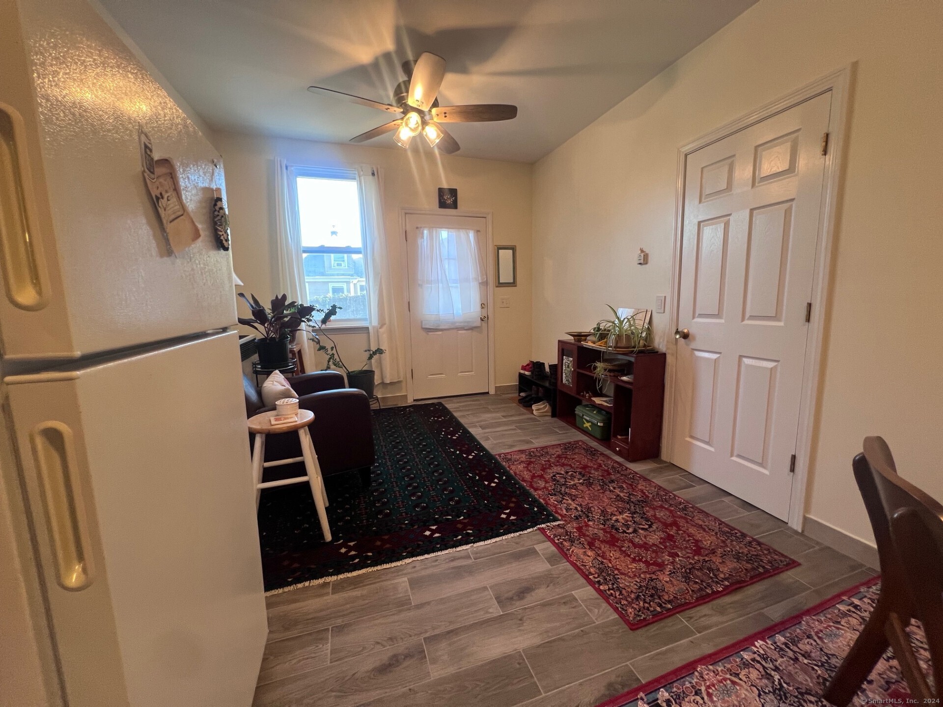 2979 Fairfield Avenue, Unit 1R Bridgeport, CT 06605 - Photo 2 of 13 a living room with furniture and a rug