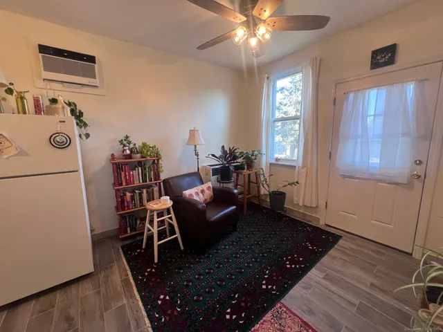 a living room with furniture and a window