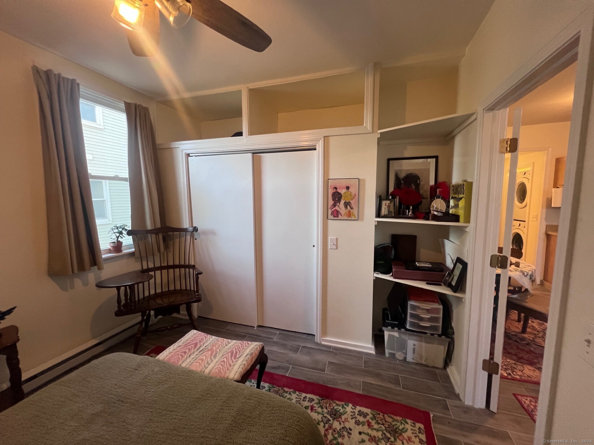 2979 Fairfield Avenue, Unit 1R Bridgeport, CT 06605 - Photo 6 of 13 a view of walk in closet with clothes and shoes