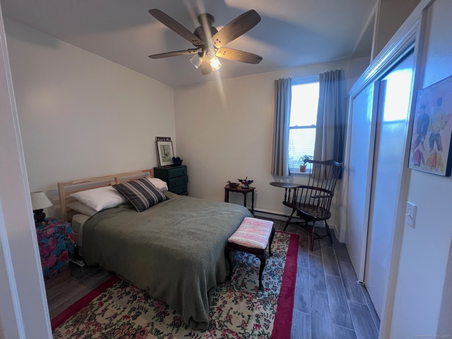 2979 Fairfield Avenue, Unit 1R Bridgeport, CT 06605 - Photo 7 of 13 a bedroom with a bed and a table in it