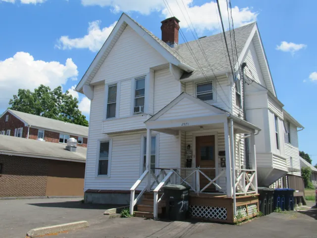 a front view of a house with a garage