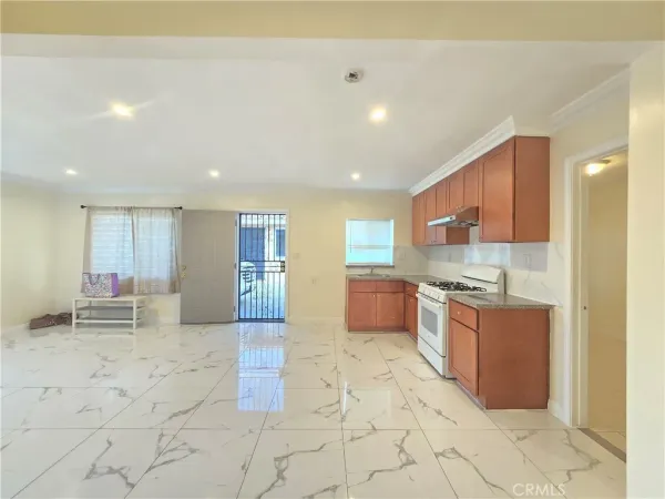a large kitchen with stainless steel appliances lots of counter top space and cabinets
