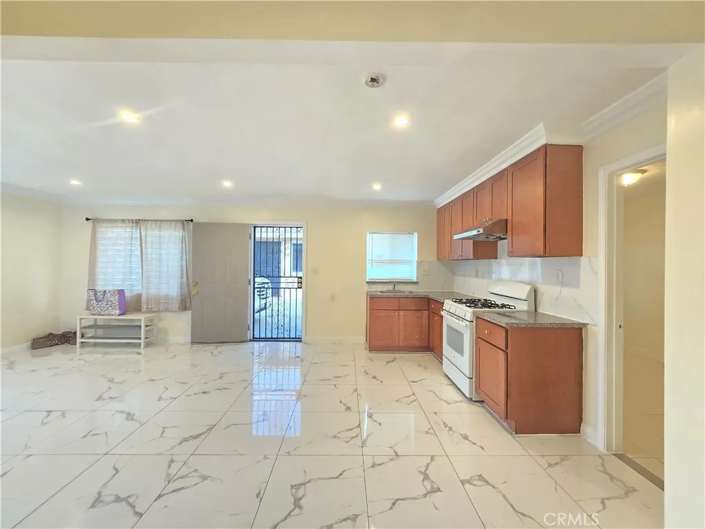 11323 Schmidt Road El Monte, CA 91733 - Photo 8 of 12 a large kitchen with stainless steel appliances lots of counter top space and cabinets