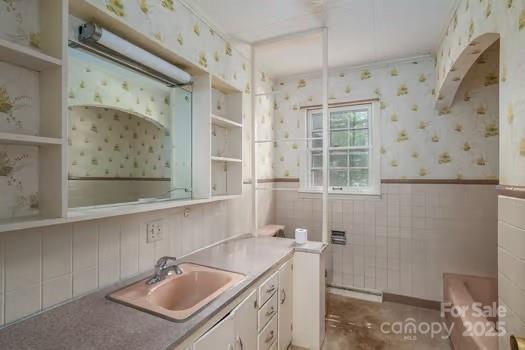 5955 Reepsville Road Vale, NC 28168 - Photo 32 of 48 a bathroom with a sink and a mirror