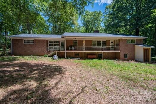 5955 Reepsville Road Vale, NC 28168 - Photo 33 of 48 a view of a house with a yard and large trees