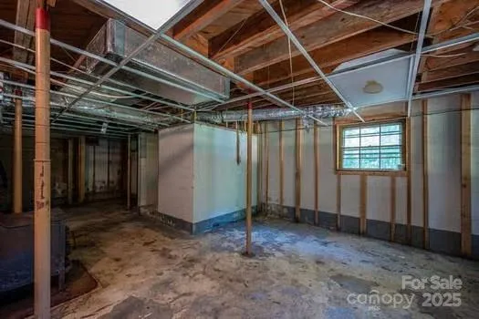 a view of an empty room with wooden walls
