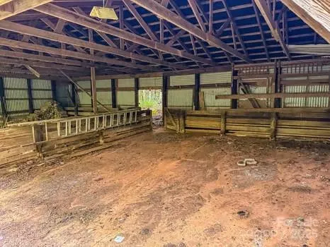 a view of porch with wooden stairs