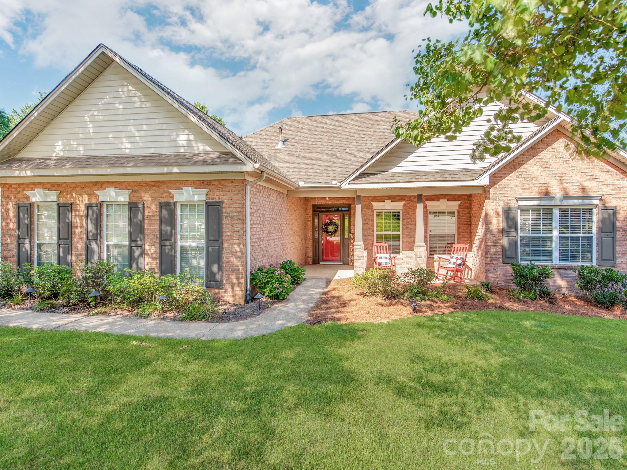 783 Sloan Street Denver, NC 28037 - Photo 2 of 44 a front view of a house with garden