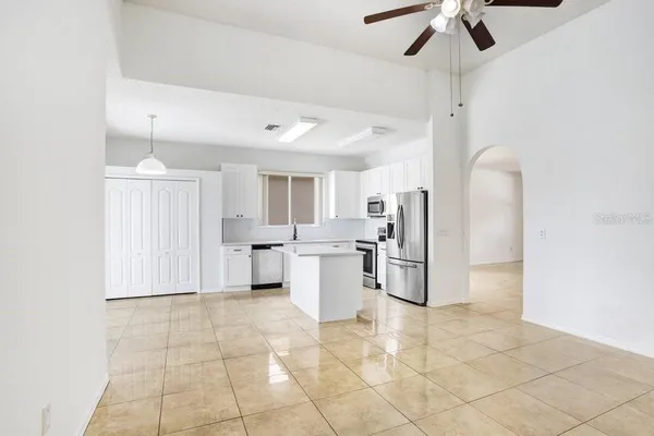 a kitchen with a sink cabinets and stainless steel appliances