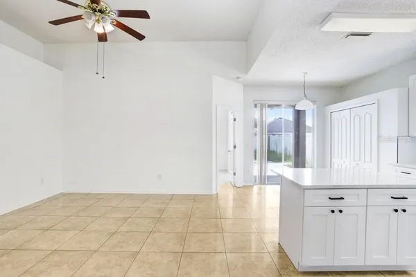 a view of an entryway with kitchen