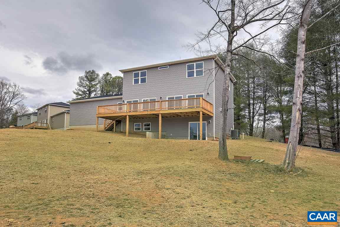 663 Pine Bluff Road Ruckersville, VA 22968 - Photo 22 of 24 a front view of a house with a yard