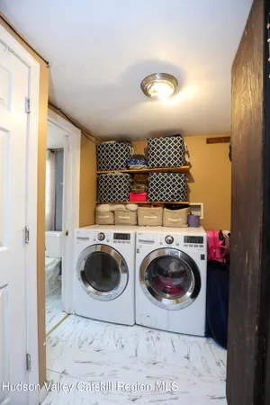 a view of bathroom with a washer and dryer