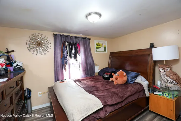 a bedroom with a bed and a closet