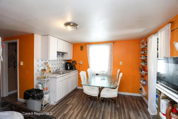 a kitchen with a stove a sink and a refrigerator
