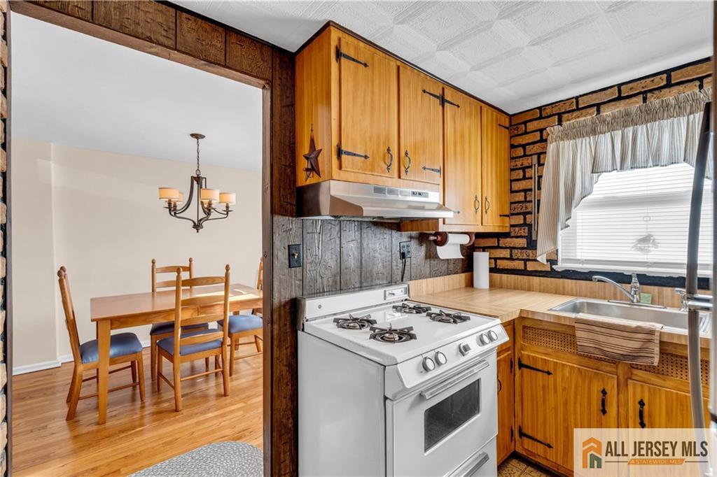 191 Rose Street Metuchen, NJ 08840 - Photo 14 of 20 a kitchen with a stove a sink and a refrigerator