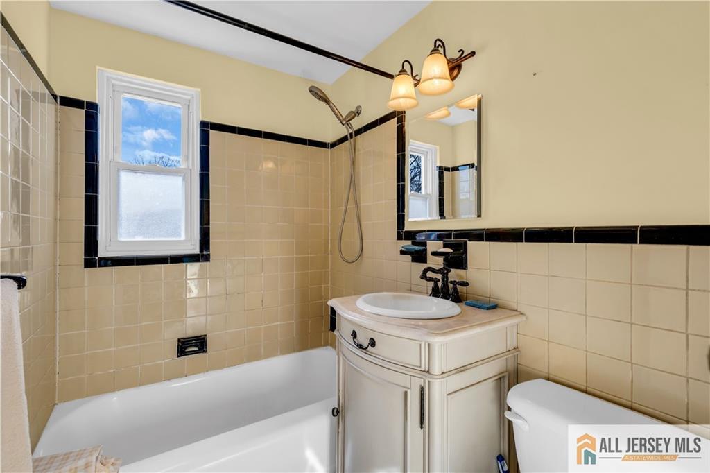 191 Rose Street Metuchen, NJ 08840 - Photo 16 of 20 a bathroom with a sink a toilet and shower