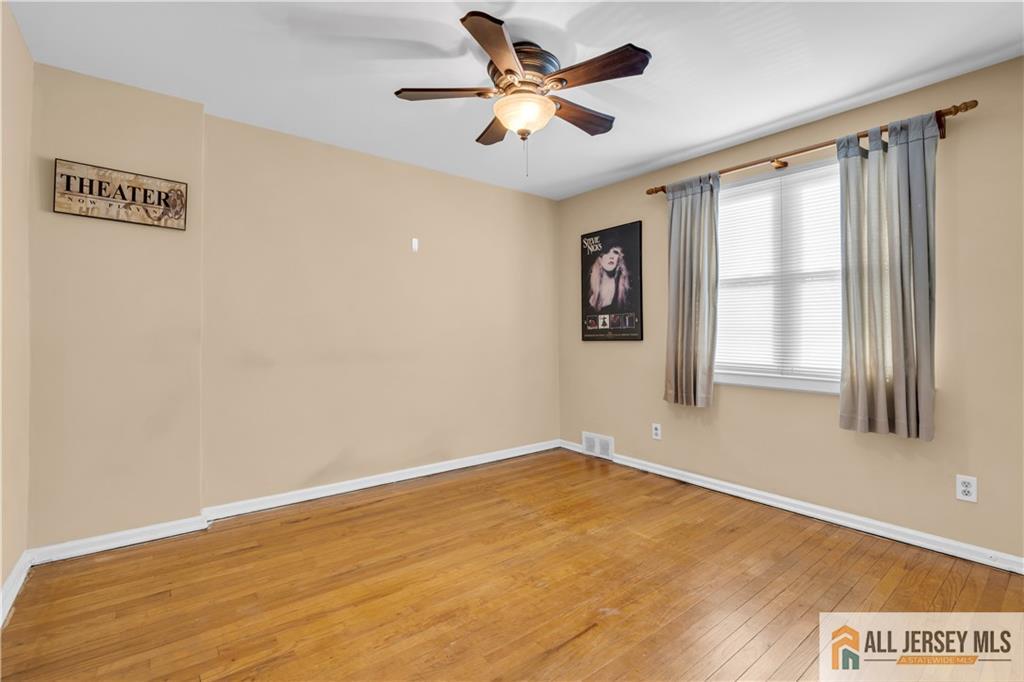 191 Rose Street Metuchen, NJ 08840 - Photo 17 of 20 a view of an empty room with a window