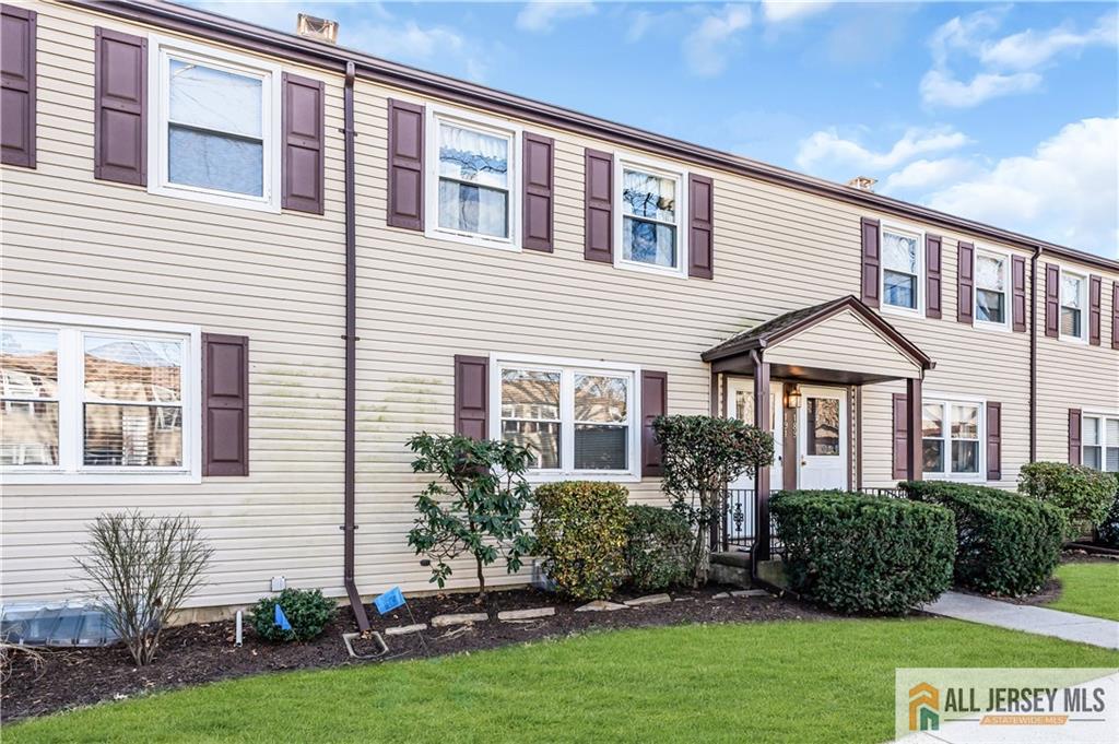 191 Rose Street Metuchen, NJ 08840 - Photo 2 of 20 a front view of a house with a yard