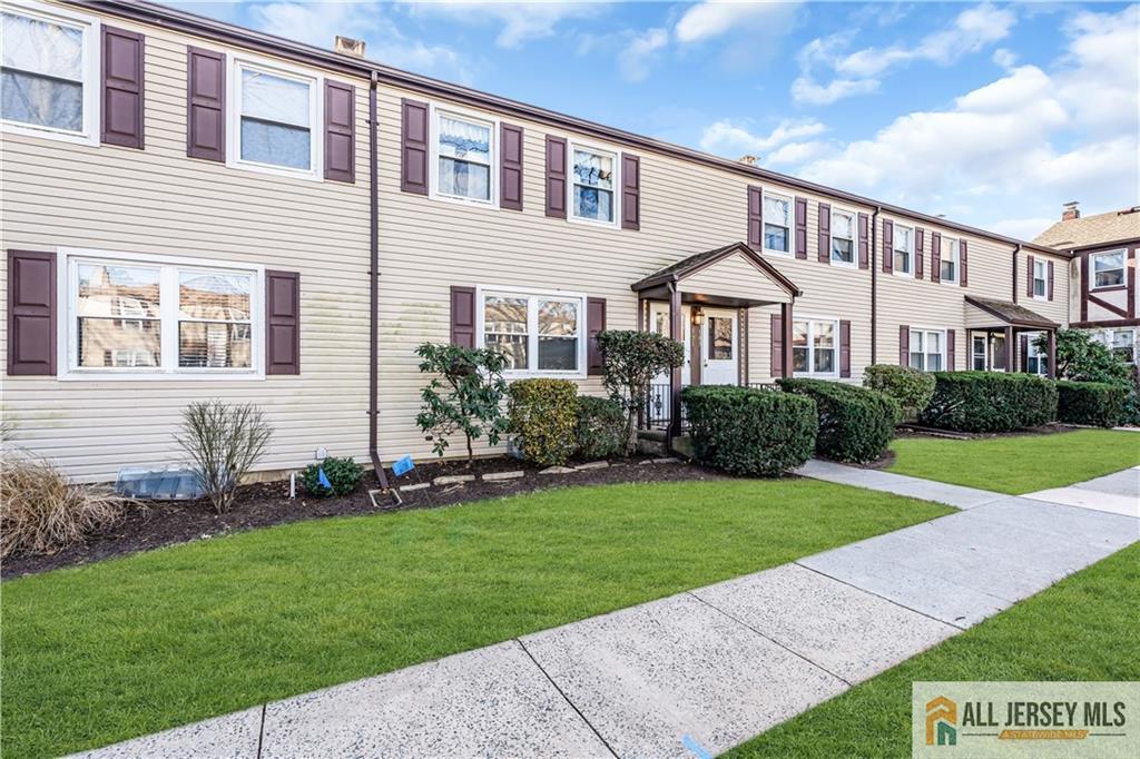 191 Rose Street Metuchen, NJ 08840 - Photo 3 of 20 a front view of a house with a yard