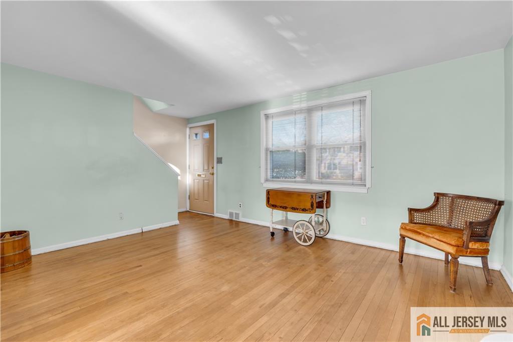 191 Rose Street Metuchen, NJ 08840 - Photo 9 of 20 a living room with furniture and a table