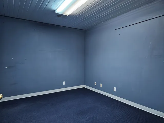 a kitchen with granite countertop a sink cabinets and stainless steel appliances