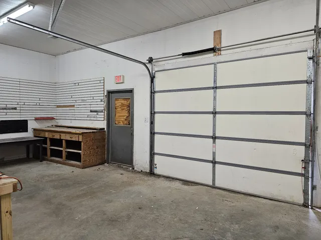 a kitchen with stainless steel appliances kitchen island sink cabinets and stove
