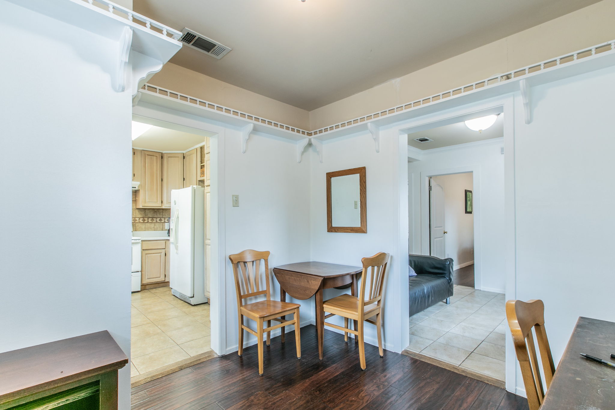 1107 Vargas Road Austin, TX 78741 - Photo 7 of 17 Rich hardwood floors welcome you, with a cozy breakfast nook for intimate meals.