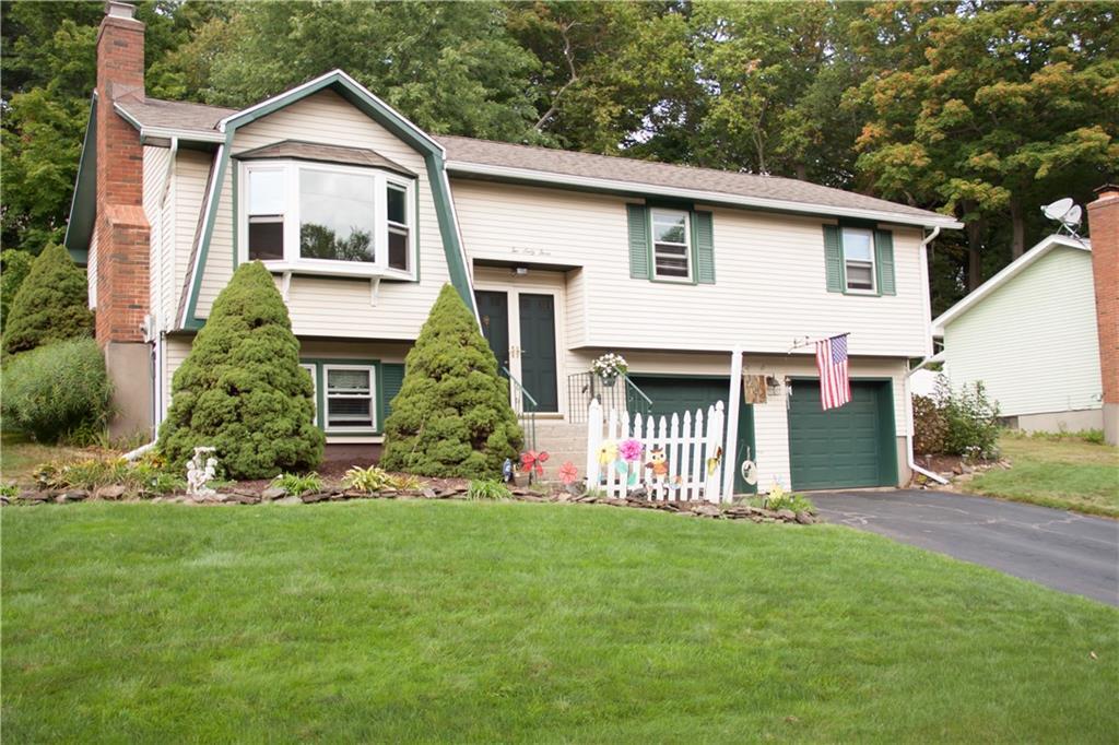 263 Old Stagecoach Road Meriden, CT 06450 - Photo 1 of 1 a front view of a house with a yard