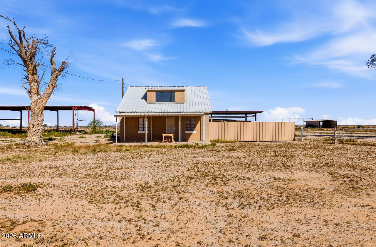 3384 East Cornman Road Casa Grande, AZ 85194 - Photo 1 of 58 a front view of a house with a yard