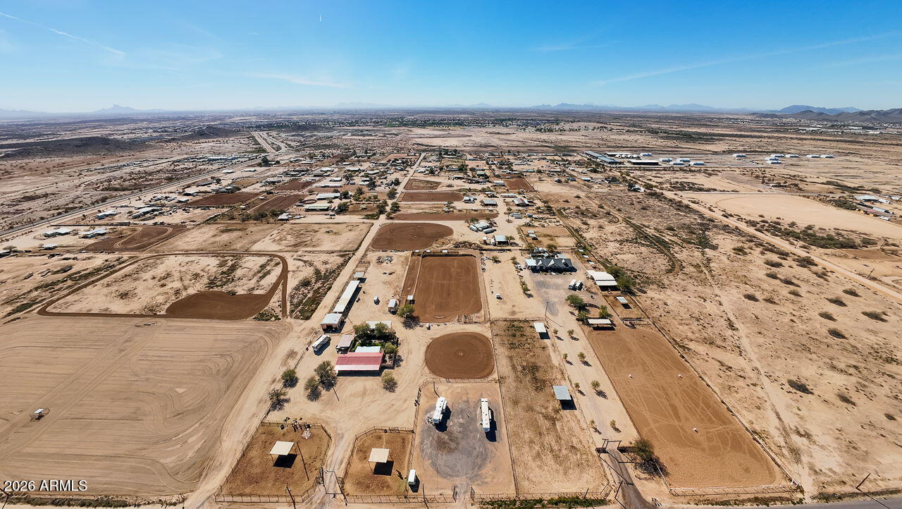 3384 East Cornman Road Casa Grande, AZ 85194 - Photo 19 of 58 an aerial view of residential houses with outdoor space
