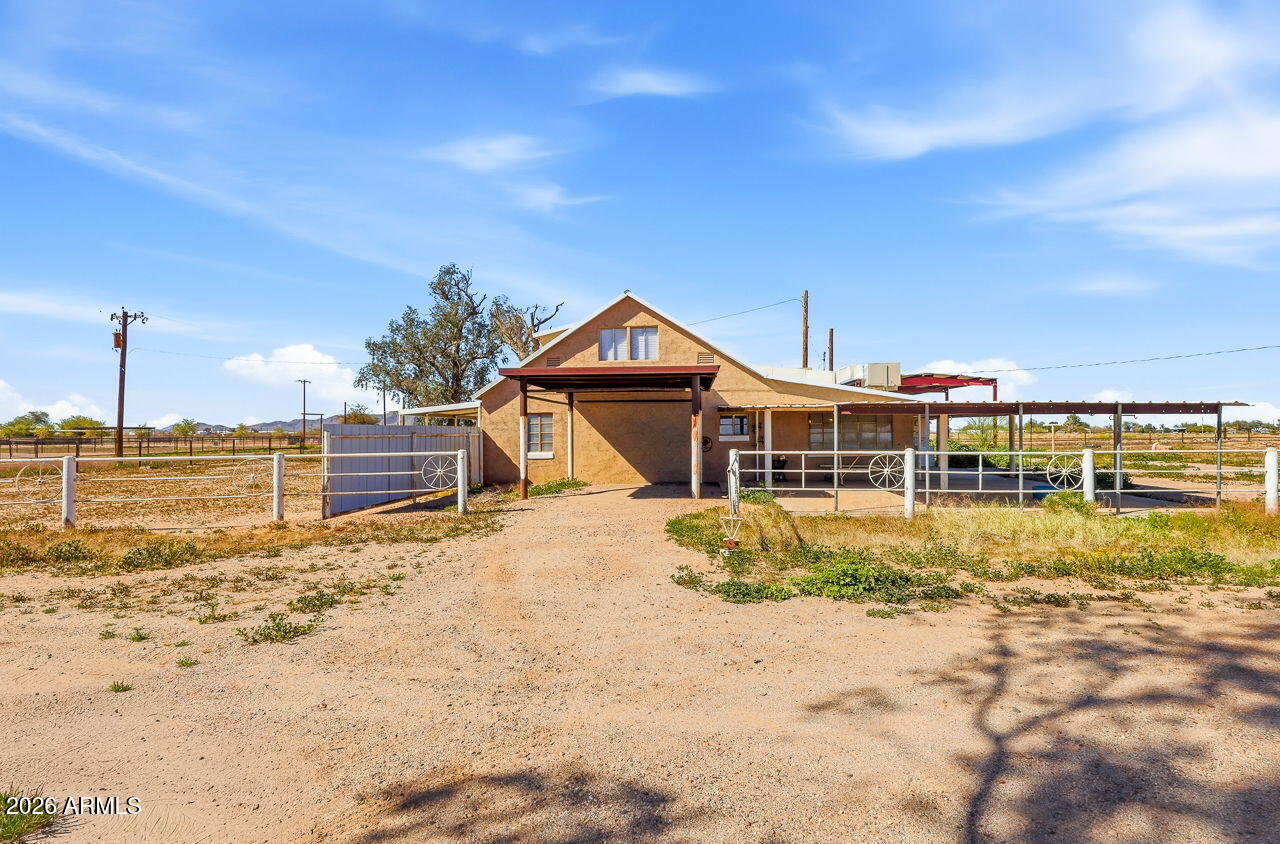 3384 East Cornman Road Casa Grande, AZ 85194 - Photo 2 of 58 a front view of a house with a yard