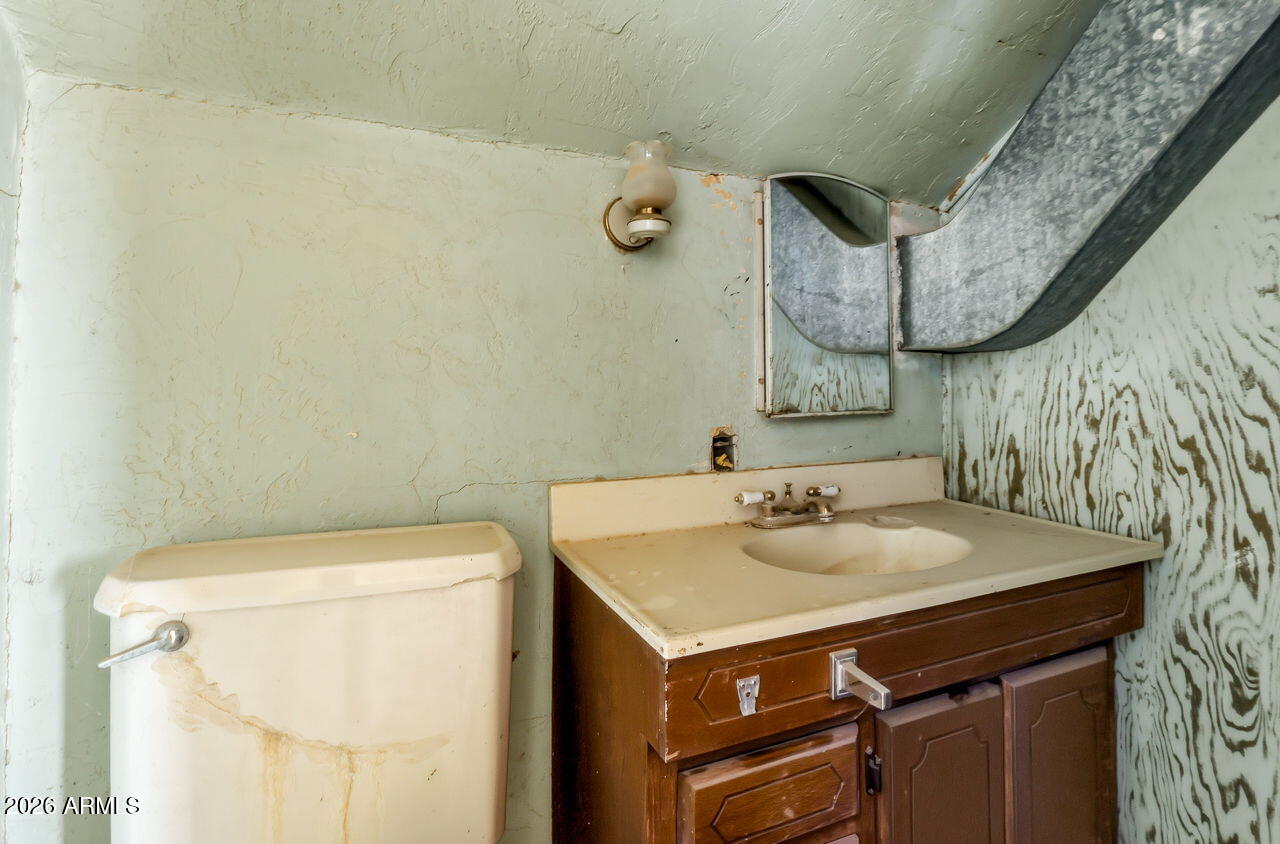 3384 East Cornman Road Casa Grande, AZ 85194 - Photo 28 of 58 a bathroom with a sink and a mirror