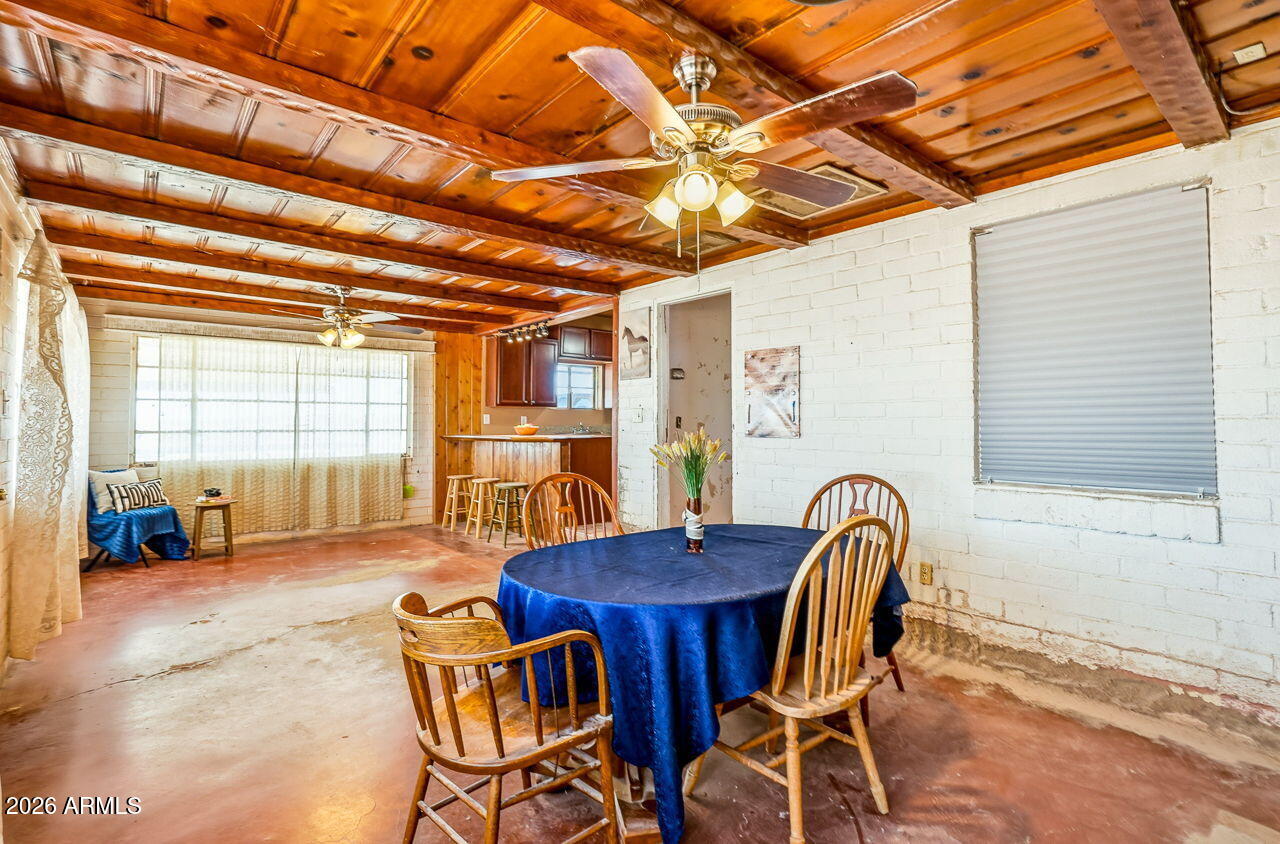 3384 East Cornman Road Casa Grande, AZ 85194 - Photo 31 of 58 a view of a dining room with furniture and window