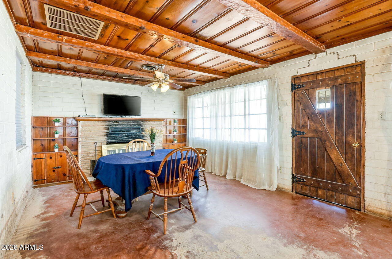 3384 East Cornman Road Casa Grande, AZ 85194 - Photo 32 of 58 a view of a dining room with furniture window and outside view