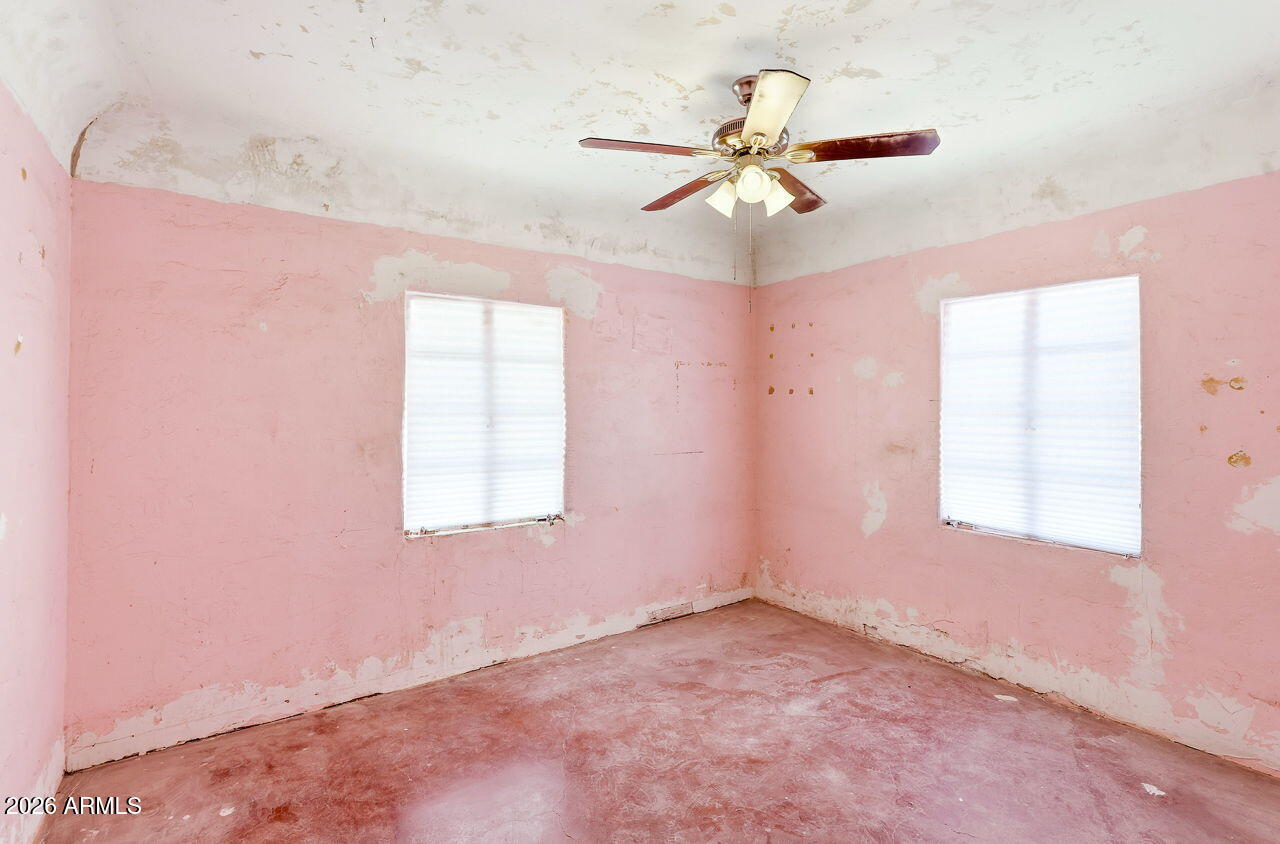 3384 East Cornman Road Casa Grande, AZ 85194 - Photo 46 of 58 an empty room with windows and fan