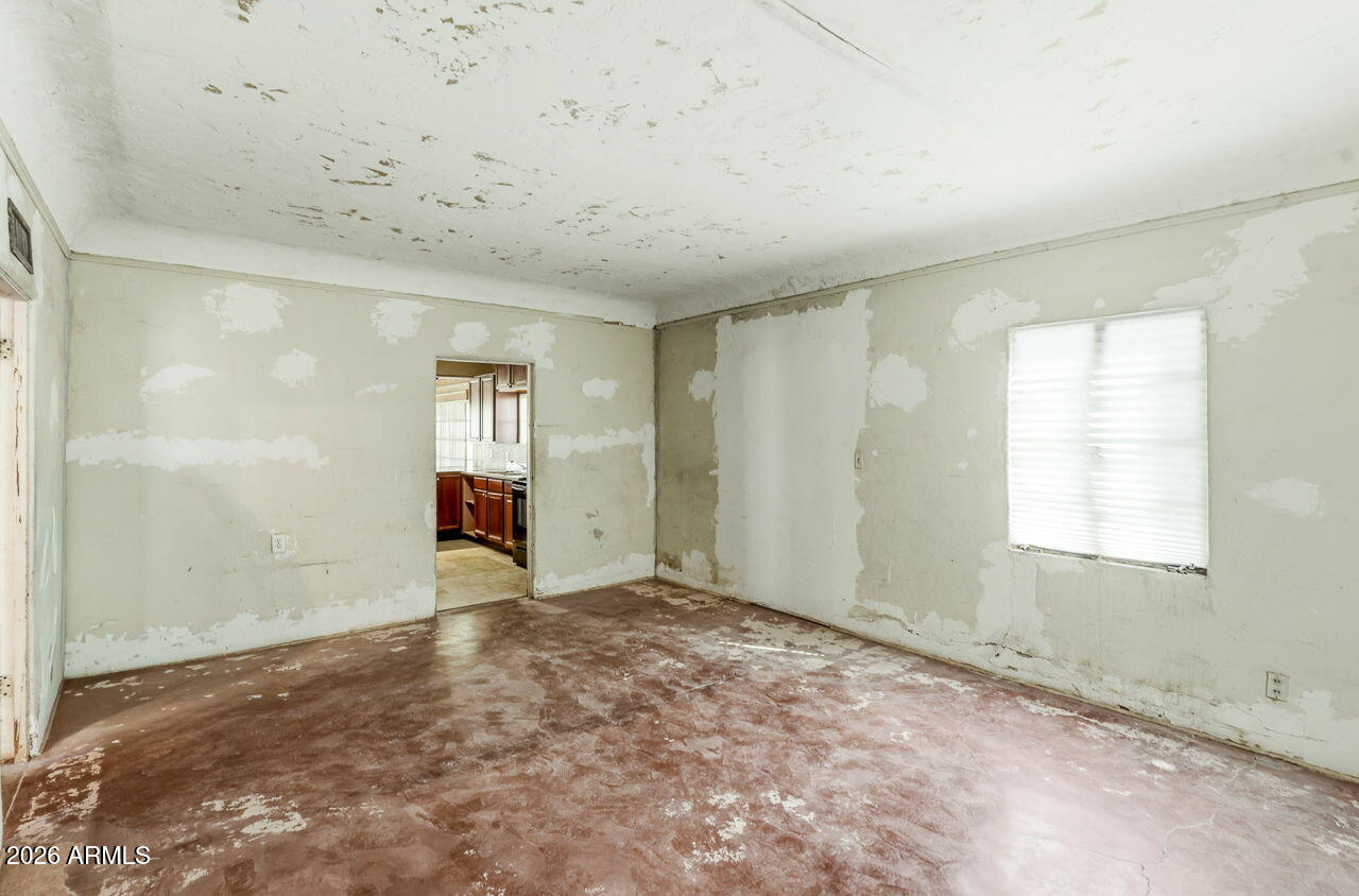 3384 East Cornman Road Casa Grande, AZ 85194 - Photo 50 of 58 an empty room with windows
