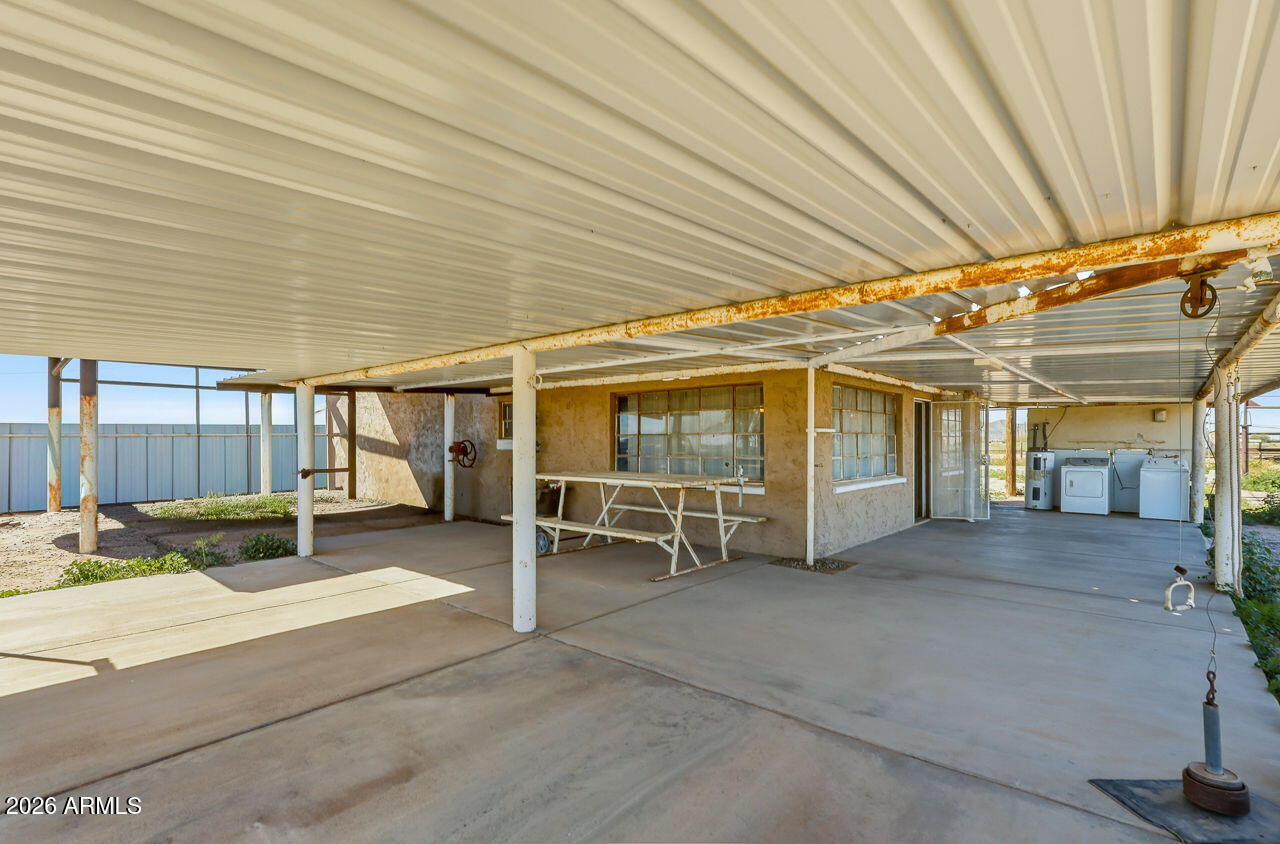 3384 East Cornman Road Casa Grande, AZ 85194 - Photo 52 of 58 a view of a patio with table and chairs
