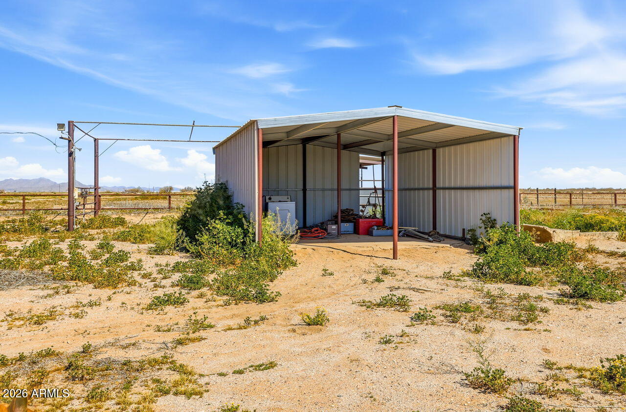 3384 East Cornman Road Casa Grande, AZ 85194 - Photo 58 of 58 a view of a house with a backyard