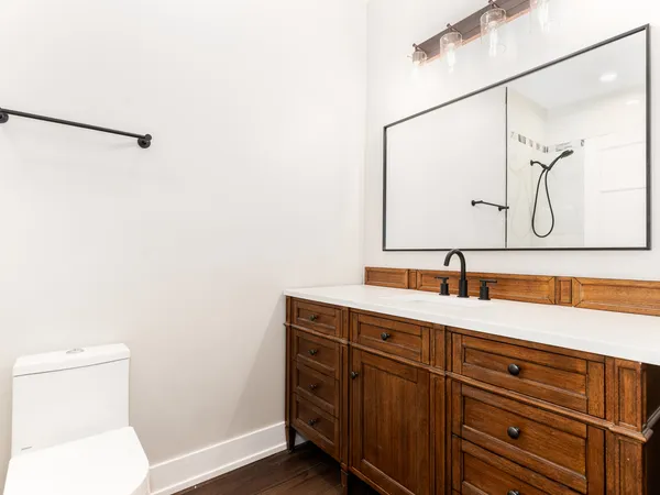 a bathroom with a bath tub with a shower