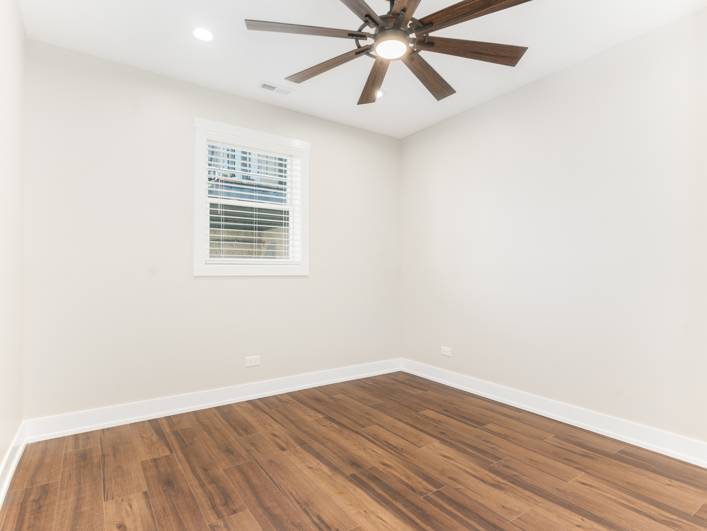 638 West 47th Street Chicago, IL 60609 - Photo 14 of 24 an empty room with wooden floor fan and windows
