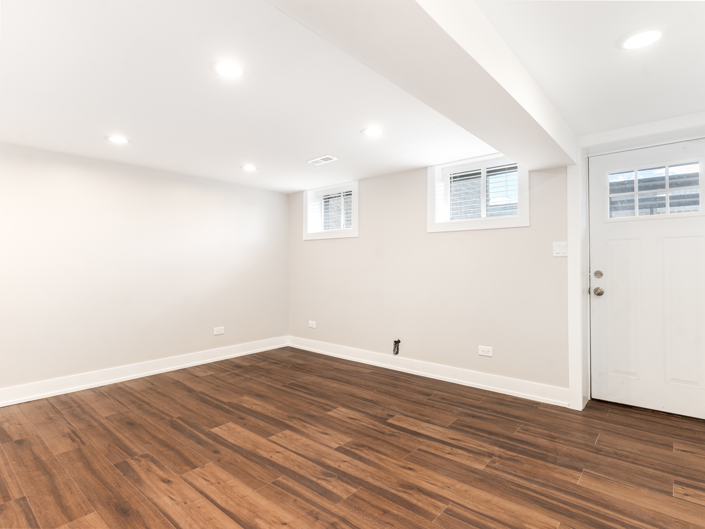 638 West 47th Street Chicago, IL 60609 - Photo 16 of 24 an empty room with wooden floor and windows